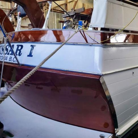 Wood repairs, colour match staining, penwork and 4 coats of Epifanes, roller tip on transom